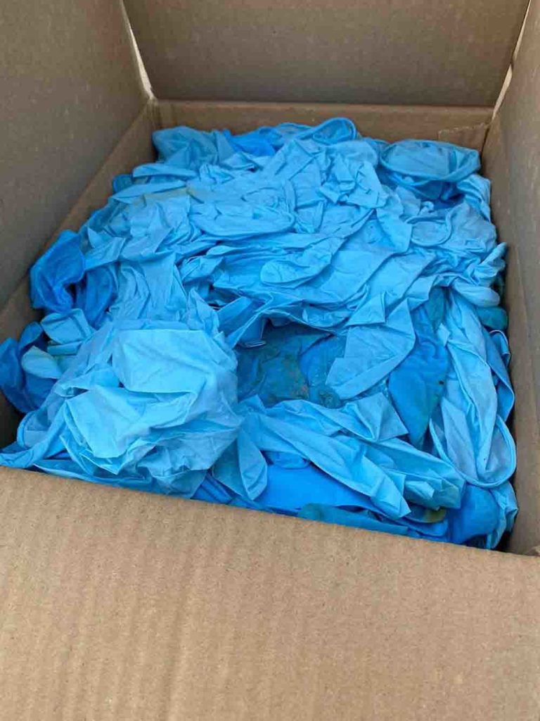 used blue nitrile gloves captured